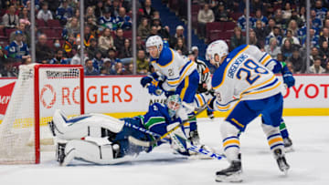 Mar 20, 2022; Vancouver, British Columbia, CAN; Vancouver Canucks goalie Thatcher Demko (35) makes a stacked pad save on Buffalo Sabres forward Zemgus Girgensons (28) in the second period at Rogers Arena. Mandatory Credit: Bob Frid-USA TODAY Sports