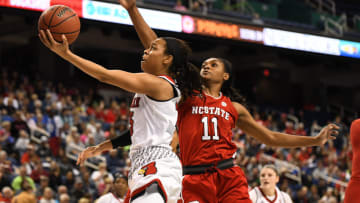 GREENSBORO, NC - MARCH 03: Louisville Cardinals guard Asia Durr (25) shoots around North Carolina State Wolfpack guard Kiara Leslie (11) during the ACC women's tournament game between the NC State Wolfpack and the Louisville Cardinals on March 3, 2018, at Greensboro Coliseum Complex in Greensboro, NC. (Photo by William Howard/Icon Sportswire via Getty Images)