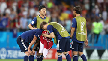 ROSTOV-ON-DON, RUSSIA - JULY 02: Gotoku Sakai of Japan consoles teammate Gen Shoji following their sides defeat in the 2018 FIFA World Cup Russia Round of 16 match between Belgium and Japan at Rostov Arena on July 2, 2018 in Rostov-on-Don, Russia. (Photo by Catherine Ivill/Getty Images)