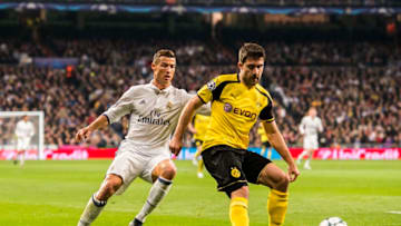 MADRID, SPAIN - DECEMBER 08: Sokratis Papastathopoulos (r) of Borussia Dortmund competes for the ball with Cristiano Ronaldo of Real Madrid during the 2016-17 UEFA Champions League match between Real Madrid and Borussia Dortmund at the Santiago Bernabeu Stadium on 07 December 2016 in Madrid, Spain. (Photo by Power Sport Images/Getty Images)
