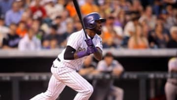 Sep 5, 2015; Denver, CO, USA; Colorado Rockies shortstop Jose Reyes (7) hits an RBI single during the third inning against the San Francisco Giants at Coors Field. Mandatory Credit: Chris Humphreys-USA TODAY Sports