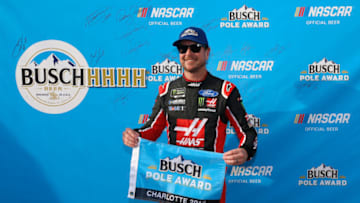 CHARLOTTE, NC - SEPTEMBER 28: Kurt Busch, driver of the #41 Haas Automation/Monster Energy Ford, poses with the Busch Pole Award after posting the fast lap during qualifying for the Monster Energy NASCAR Cup Series Bank of America Roval 400 at Charlotte Motor Speedway on September 28, 2018 in Charlotte, North Carolina. (Photo by Jonathan Ferrey/Getty Images)