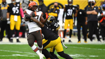 PITTSBURGH, PENNSYLVANIA - OCTOBER 18: Kareem Hunt #27 of the Cleveland Browns is tackled by the Pittsburgh Steelers during their NFL game at Heinz Field on October 18, 2020 in Pittsburgh, Pennsylvania. (Photo by Joe Sargent/Getty Images)