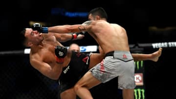 DENVER, CO - NOVEMBER 10: FS1 PRELIMS Mark De La Rosa takes a shot from Joby Sanchez. De La Rosa won their bantamweight 3round bout in a split decision during UFC Fight Night Main Card at the Pepsi Center on November 10, 2018 in Denver, Colorado. (Photo by Joe Amon/The Denver Post via Getty Images)