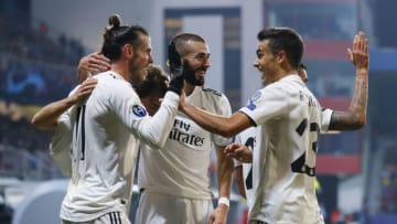 PLZEN, CZECH REPUBLIC - NOVEMBER 07: Gareth Bale (L) of Real Madrid celebrates with Karim Benzema (C) and Segio Reguilon after scoring their team's fourth goal during the Group G match of the UEFA Champions League between Viktoria Plzen and Real Madrid at Doosan Arena on November 7, 2018 in Plzen, Czech Republic. (Photo by Angel Martinez/Real Madrid via Getty Images)