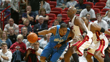 MIAMI - MARCH 9: Tracy McGrady #1 of the Orlando Magic drives against Lamar Odom #7 of the Miami Heat during NBA action on March 9, 2004 at American Airlines Arena in Miami, MIAMI - MARCH 9: Dwyane Wade #3 of the Miami Heat dunks against the Orlando Magic during NBA action on March 9, 2004 at American Airlines Arena in Miami, Florida. NOTE TO USER: User expressly acknowledges and agrees that, by downloading and/or using this Photograph, User is consenting to the terms and conditions of the Getty Images License Agreement. (Photo by Issac Baldizon/NBAE via Getty Images)
