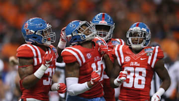 NEW ORLEANS, LA - JANUARY 01: C.J. Johnson #10 of the Mississippi Rebels celebrates sacking the Oklahoma State Cowboys quarterback during the third quarter of the Allstate Sugar Bowl at Mercedes-Benz Superdome on January 1, 2016 in New Orleans, Louisiana. (Photo by Chris Graythen/Getty Images)