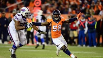 Dec 7, 2014; Denver, CO, USA; Buffalo Bills tackle Seantrel Henderson (66) pass protects on Denver Broncos outside linebacker Von Miller (58) in the third quarter at Sports Authority Field at Mile High. The Broncos defeated the Bills 24-17. Mandatory Credit: Ron Chenoy-USA TODAY Sports