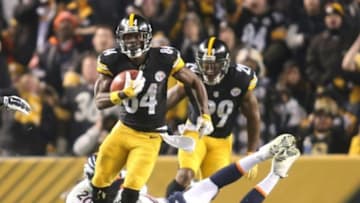 Dec 20, 2015; Pittsburgh, PA, USA; Pittsburgh Steelers wide receiver Antonio Brown (84) returns a punt past Denver Broncos long snapper Aaron Brewer (46) and defensive back Josh Bush (20) during the third quarter at Heinz Field. The Steelers won 34-27. Mandatory Credit: Charles LeClaire-USA TODAY Sports