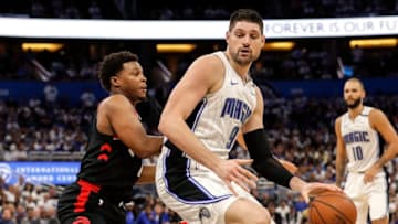 ORLANDO, FL - APRIL 19: Nikola Vucevic #9 of the Orlando Magic backs Kyle Lowry #7 of the Toronto Raptors in the post during Game Three of the first round of the 2019 NBA Eastern Conference Playoffs at the Amway Center on April 19, 2019 in Orlando, Florida. The Raptors defeated the Magic 98 to 93. NOTE TO USER: User expressly acknowledges and agrees that, by downloading and or using this photograph, User is consenting to the terms and conditions of the Getty Images License Agreement. (Photo by Don Juan Moore/Getty Images)