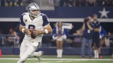 Nov 26, 2015; Arlington, TX, USA; Dallas Cowboys quarterback Tony Romo (9) rolls out to pass against the Carolina Panthers during the first quarter of an NFL game on Thanksgiving at AT&T Stadium. Mandatory Credit: Jerome Miron-USA TODAY Sports