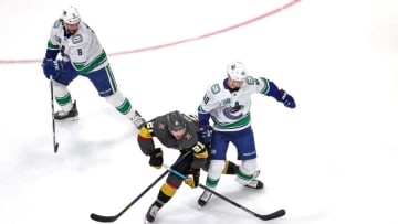Nick Cousins #21 of the Vegas Golden Knights and Elias Pettersson #40 of the Vancouver Canucks battle for the puck during the second period in Game Two of the Western Conference Second Round. (Photo by Bruce Bennett/Getty Images)