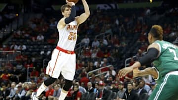 Apr 19, 2016; Atlanta, GA, USA; Atlanta Hawks guard Kyle Korver (26) attempts a three-point basket against Boston Celtics center Jared Sullinger (7) in the first quarter of game two of the first round of the NBA Playoffs at Philips Arena. The Hawks won 89-72. Mandatory Credit: Jason Getz-USA TODAY Sports