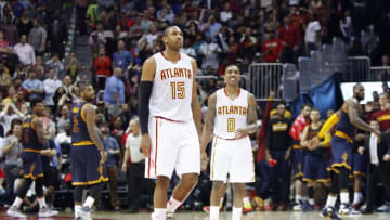 Apr 1, 2016; Atlanta, GA, USA; Atlanta Hawks center Al Horford (15) and guard Jeff Teague (0) show emotion after an overtime loss against the Cleveland Cavaliers at Philips Arena. The Cavaliers defeated the Hawks 110-108. Mandatory Credit: Brett Davis-USA TODAY Sports