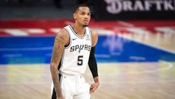 DETROIT, MICHIGAN - MARCH 15: Dejounte Murray #5 of the San Antonio Spurs looks on against the Detroit Pistons during the third quarter at Little Caesars Arena on March 15, 2021 in Detroit, Michigan. NOTE TO USER: User expressly acknowledges and agrees that, by downloading and or using this photograph, User is consenting to the terms and conditions of the Getty Images License Agreement. (Photo by Nic Antaya/Getty Images)