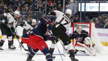 Nov 16, 2023; Columbus, Ohio, USA; Columbus Blue Jackets goalie Elvis Merzlikins (90) makes a stick save on the shot from Arizona Coyotes center Nick Bjugstad (17) during the first period at Nationwide Arena. Mandatory Credit: Russell LaBounty-USA TODAY Sports