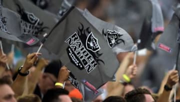 Sep 28, 2014; London, UNITED KINGDOM; Oakland Raiders fans wave Raider Nation flags against Miami Dolphins in the NFL International Series game at Wembley Stadium. Mandatory Credit: Kirby Lee-USA TODAY Sports