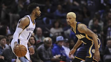 Dec 19, 2015; Memphis, TN, USA; Memphis Grizzlies guard Mike Conley (11) handles the ball against Indiana Pacers guard George Hill (3) during the second quarter at FedExForum. Mandatory Credit: Justin Ford-USA TODAY Sports