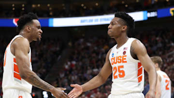 SALT LAKE CITY, UTAH - MARCH 21: Tyus Battle #25 of the Syracuse Orange celebrates with teammate Oshae Brissett #11 against the Baylor Bears during the first half in the first round of the 2019 NCAA Men's Basketball Tournament at Vivint Smart Home Arena on March 21, 2019 in Salt Lake City, Utah. (Photo by Patrick Smith/Getty Images)