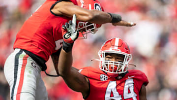 Travon Walker celebrates a sack with Nolan Smith during a game. (Photo by Steven Limentani/ISI Photos/Getty Images)