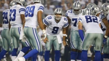 Sep 28, 2014; Arlington, TX, USA; Dallas Cowboys quarterback Tony Romo (9) calls the play in the huddle against the New Orleans Saints at AT&T Stadium. Mandatory Credit: Matthew Emmons-USA TODAY Sports