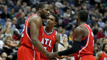 Mar 26, 2014; Minneapolis, MN, USA; Atlanta Hawks guard Louis Williams (3) talks with forward Elton Brand (42) during the third quarter against the Minnesota Timberwolves at Target Center. The Timberwolves defeated the Hawks 107-83. Mandatory Credit: Brace Hemmelgarn-USA TODAY Sports