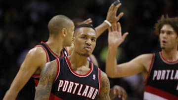 Jan 17, 2014; San Antonio, TX, USA; Portland Trail Blazers guard Damian Lillard (0) reacts during the second half against the San Antonio Spurs at AT
