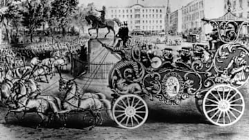 1860: The 'band wagon' of Van Amburgh's circus parade, the 'Great Golden Chariot' passes Union Square, New York. The chariot was the central attraction of the circus parade; it weighed 6000 pounds and cost $7,000, an unheard of sum in those days. (Photo by Three Lions/Getty Images)