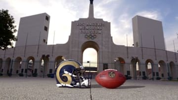Mar 4, 2016; Los Angeles, CA, USA; General view of Los Angeles Rams helmet and NFL Wilson Duke football and the Olympic torch at the peristyle end of the Los Angeles Memorial Coliseum. The Coliseum will serve as the temporary home of the Rams after NFL owners voted 30-2 to allow Rams owner Stan Kroenke (not pictured) to relocate the franchise for the 2016 season. Mandatory Credit: Kirby Lee-USA TODAY Sports