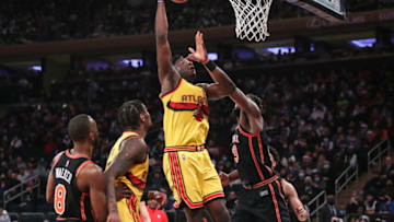 Dec 25, 2021; New York, New York, USA; Atlanta Hawks center Clint Capela (15) shoots over New York Knicks center Mitchell Robinson (23) in the second quarter at Madison Square Garden. Mandatory Credit: Wendell Cruz-USA TODAY Sports