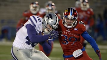 Nov 28, 2015; Lawrence, KS, USA; Kansas State Wildcats fullback Glenn Gronkowski (48) is tackled by Kansas Jayhawks safety Michael Glatczak (39) in the second half at Memorial Stadium. Kansas State won the game 45-14. Mandatory Credit: John Rieger-USA TODAY Sports