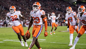 COLUMBIA, SOUTH CAROLINA - NOVEMBER 27: Cornerback Andrew Booth Jr. #23 of the Clemson Tigers reacts after making an interception against the South Carolina Gamecocks in the first quarter during their game at Williams-Brice Stadium on November 27, 2021 in Columbia, South Carolina. (Photo by Jacob Kupferman/Getty Images)