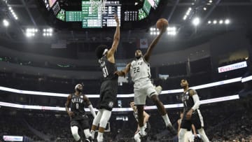 MILWAUKEE, WISCONSIN - APRIL 06: Khris Middleton #22 of the Milwaukee Bucks shoots a lay up in the first half Jarrett Allen #31 of the Brooklyn Nets at Fiserv Forum on April 06, 2019 in Milwaukee, Wisconsin. NOTE TO USER: User expressly acknowledges and agrees that, by downloading and or using this photograph, User is consenting to the terms and conditions of the Getty Images License Agreement. (Photo by Quinn Harris/Getty Images)
