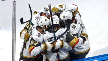 Zach Whitecloud #2 of the Vegas Golden Knights is congratulated by his teammates after scoring a goal against the Vancouver Canucks during the first period in Game Three of the Western Conference Second Round. (Photo by Bruce Bennett/Getty Images)