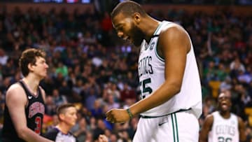 BOSTON, MA - APRIL 6: Greg Monroe #55 of the Boston Celtics reacts after being fouled by Omer Asik #3 of the Chicago Bulls during a game at TD Garden on April 6, 2018 in Boston, Massachusetts. NOTE TO USER: User expressly acknowledges and agrees that, by downloading and or using this photograph, User is consenting to the terms and conditions of the Getty Images License Agreement. (Photo by Adam Glanzman/Getty Images)