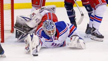 COLUMBUS, OH - JANUARY 13: Alexandar Georgiev #40 of the New York Rangers reaches out to cover up a loose puck during the game against the Columbus Blue Jackets on January 13, 2019 at Nationwide Arena in Columbus, Ohio. (Photo by Kirk Irwin/Getty Images)