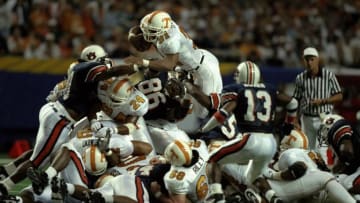 6 Dec 1997: Jamal Lewis #31 of Tennessee leaps over a pile of players for a touchdown during the Volunteers 30-29 win over Auburn in the SEC Championship at the Georgia Dome in Atlanta, Georgia.