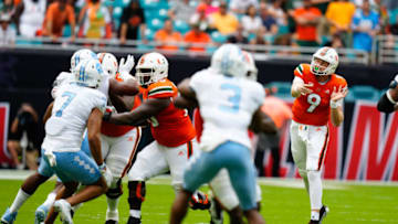 Oct 8, 2022; Miami Gardens, Florida, USA; Miami Hurricanes quarterback Tyler Van Dyke (9) throws a pass against the North Carolina Tar Heels during the first quarter at Hard Rock Stadium. Mandatory Credit: Rich Storry-USA TODAY Sports