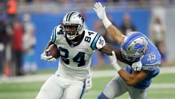 DETROIT, MI - OCTOBER 08: Ed Dickson #84 of the Carolina Panthers fights off Miles Killebrew #35 of the Detroit Lions during the first half at Ford Field on October 8, 2017 in Detroit, Michigan. (Photo by Leon Halip/Getty Images)
