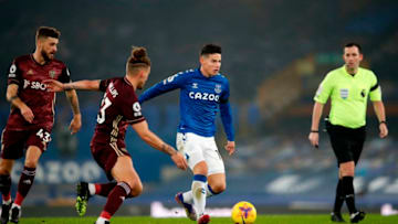 Everton's Colombian midfielder James Rodriguez (C) runs with the ball in front of Leeds United's English midfielder Kalvin Phillips (2nd L) during the English Premier League football match between Everton and Leeds United at Goodison Park in Liverpool, north west England on November 28, 2020. (Photo by Clive Brunskill / POOL / AFP) / RESTRICTED TO EDITORIAL USE. No use with unauthorized audio, video, data, fixture lists, club/league logos or 'live' services. Online in-match use limited to 120 images. An additional 40 images may be used in extra time. No video emulation. Social media in-match use limited to 120 images. An additional 40 images may be used in extra time. No use in betting publications, games or single club/league/player publications. / (Photo by CLIVE BRUNSKILL/POOL/AFP via Getty Images)