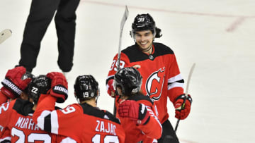Apr 4, 2021; Newark, New Jersey, USA; New Jersey Devils right wing Nicholas Merkley (39) celebrates with teammates after center Travis Zajac (19) scored a goal against the Washington Capitals during the third period at Prudential Center. Mandatory Credit: Catalina Fragoso-USA TODAY Sports