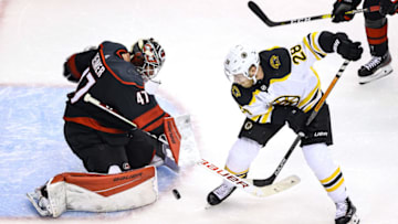 TORONTO, ONTARIO - AUGUST 17: James Reimer #47 of the Carolina Hurricanes stops a shot against Ondrej Kase #28 of the Boston Bruins during the second period in Game Four of the Eastern Conference First Round during the 2020 NHL Stanley Cup Playoffs at Scotiabank Arena on August 17, 2020 in Toronto, Ontario. (Photo by Elsa/Getty Images)