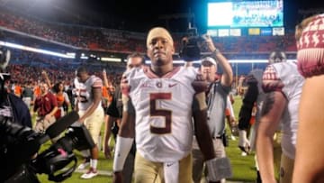 Nov 15, 2014; Miami Gardens, FL, USA; Florida State Seminoles quarterback Jameis Winston (5) walks off the field as the Florida State Seminoles beat the Miami Hurricanes 30-26 at Sun Life Stadium. Mandatory Credit: David Manning-USA TODAY Sports
