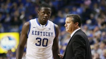 Nov 4, 2013; Lexington, KY, USA; Kentucky Wildcats head coach John Calipari gives instructions to forward Julius Randle (30) during the game against the Montevallo Falcons at Rupp Arena. Kentucky defeated Montevallo 95-72. Mandatory Credit: Mark Zerof-USA TODAY Sports
