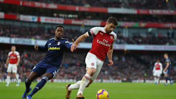 LONDON, ENGLAND - JANUARY 01: Sokratis Papastathopoulos of Arsenal holds off Ryan Sessegnon of Fulham during the Premier League match between Arsenal FC and Fulham FC at Emirates Stadium on January 1, 2019 in London, United Kingdom. (Photo by Catherine Ivill/Getty Images)