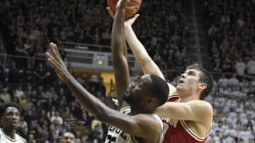 Mar 6, 2016; West Lafayette, IN, USA; Wisconsin Badgers forward Ethan Happ (22) shoots over Purdue Boilermakers guard Rapheal Davis (35) in the first half at Mackey Arena. Mandatory Credit: Sandra Dukes-USA TODAY Sports