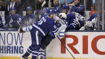 TORONTO, ON - OCTOBER 27: Toronto Maple Leafs Left Wing Zach Hyman (11) hits Winnipeg Jets Defenceman Jacob Trouba (8) into the Leafs bench during the regular season NHL game between the Winnipeg Jets and the Toronto Maple Leafs on October 27, 2018 at Scotiabank Arena in Toronto, ON. (Photo by Jeff Chevrier/Icon Sportswire via Getty Images)