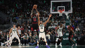 MILWAUKEE, WISCONSIN - APRIL 20: DeMar DeRozan #11 of the Chicago Bulls shoots over Giannis Antetokounmpo #34 of the Milwaukee Bucks during the second half of Game Two of the Eastern Conference First Round Playoffs at Fiserv Forum on April 20, 2022 in Milwaukee, Wisconsin. NOTE TO USER: User expressly acknowledges and agrees that, by downloading and or using this photograph, User is consenting to the terms and conditions of the Getty Images License Agreement. (Photo by Stacy Revere/Getty Images)