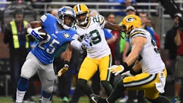 Dec 3, 2015; Detroit, MI, USA; Detroit Lions running back Theo Riddick (25) attempts to break the tackle of Green Bay Packers inside linebacker Clay Matthews (52) during the second quarter at Ford Field. Mandatory Credit: Tim Fuller-USA TODAY Sports
