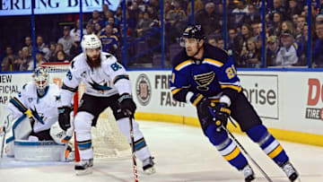 Feb 22, 2016; St. Louis, MO, USA; St. Louis Blues center Patrik Berglund (21) handles the puck as San Jose Sharks defenseman Brent Burns (88) defends during the second period at Scottrade Center. Mandatory Credit: Jeff Curry-USA TODAY Sports